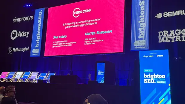 Hero Conf paid advertising stage at brightonSEO 2026, with sponsor banners and upcoming event dates for San Diego and the UK.