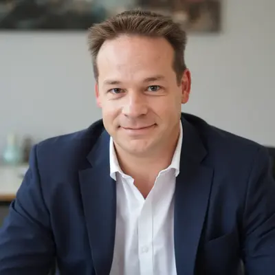 Head-and-shoulders photo of Gary Cottam in the office with a relaxed smile