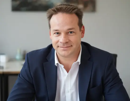 Head-and-shoulders photo of Gary Cottam in the office with a relaxed smile