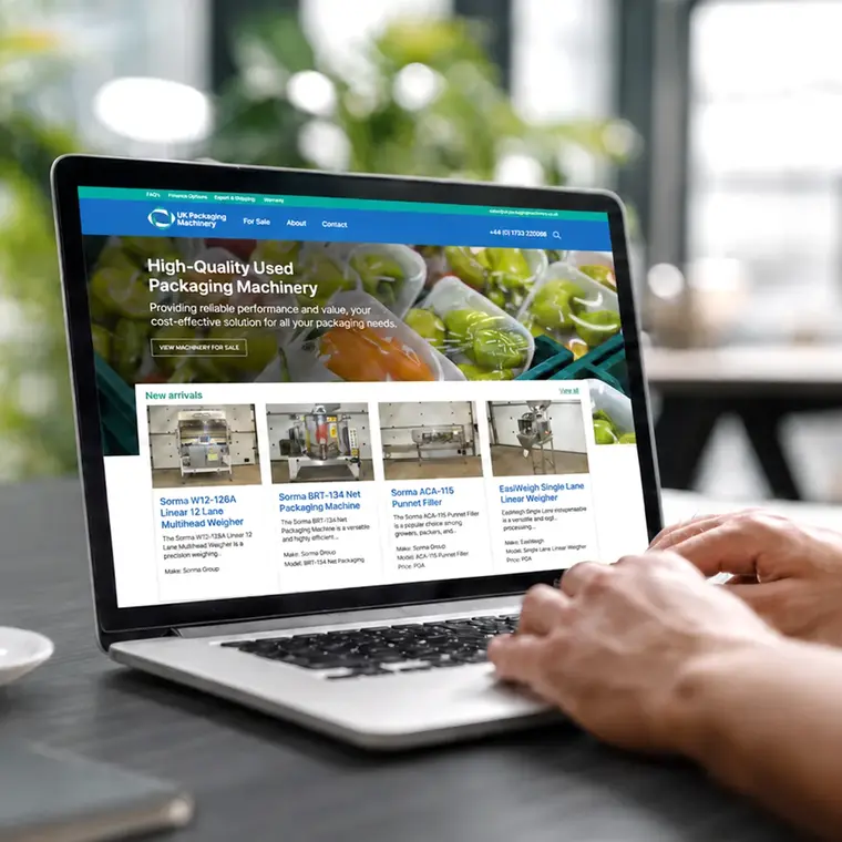 E-commerce website displayed on a laptop showing used packaging machinery products for sale.