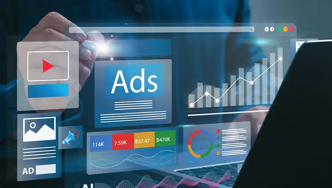 Laptop displaying Google Ads analytics dashboard with charts and graphs showing campaign performance metrics.